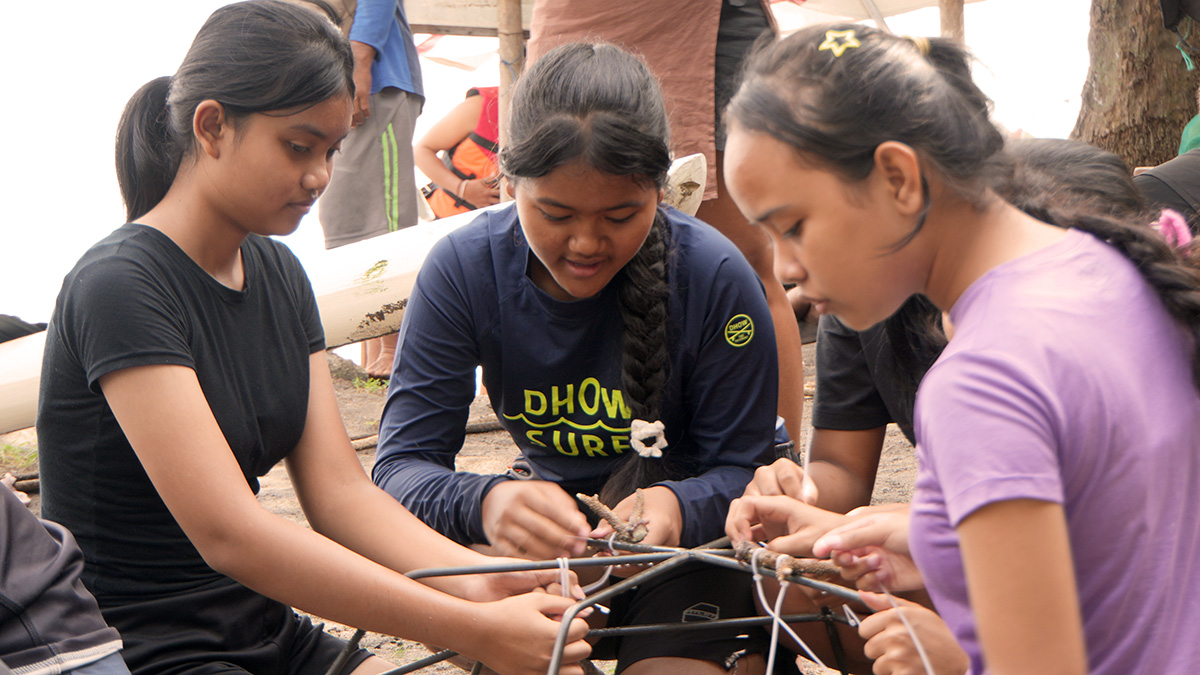 Balinese children taking part in a coral restoration activity.